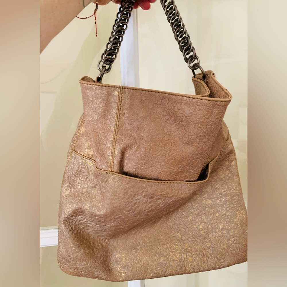 Gold handbag with bronze-toned chain handle.